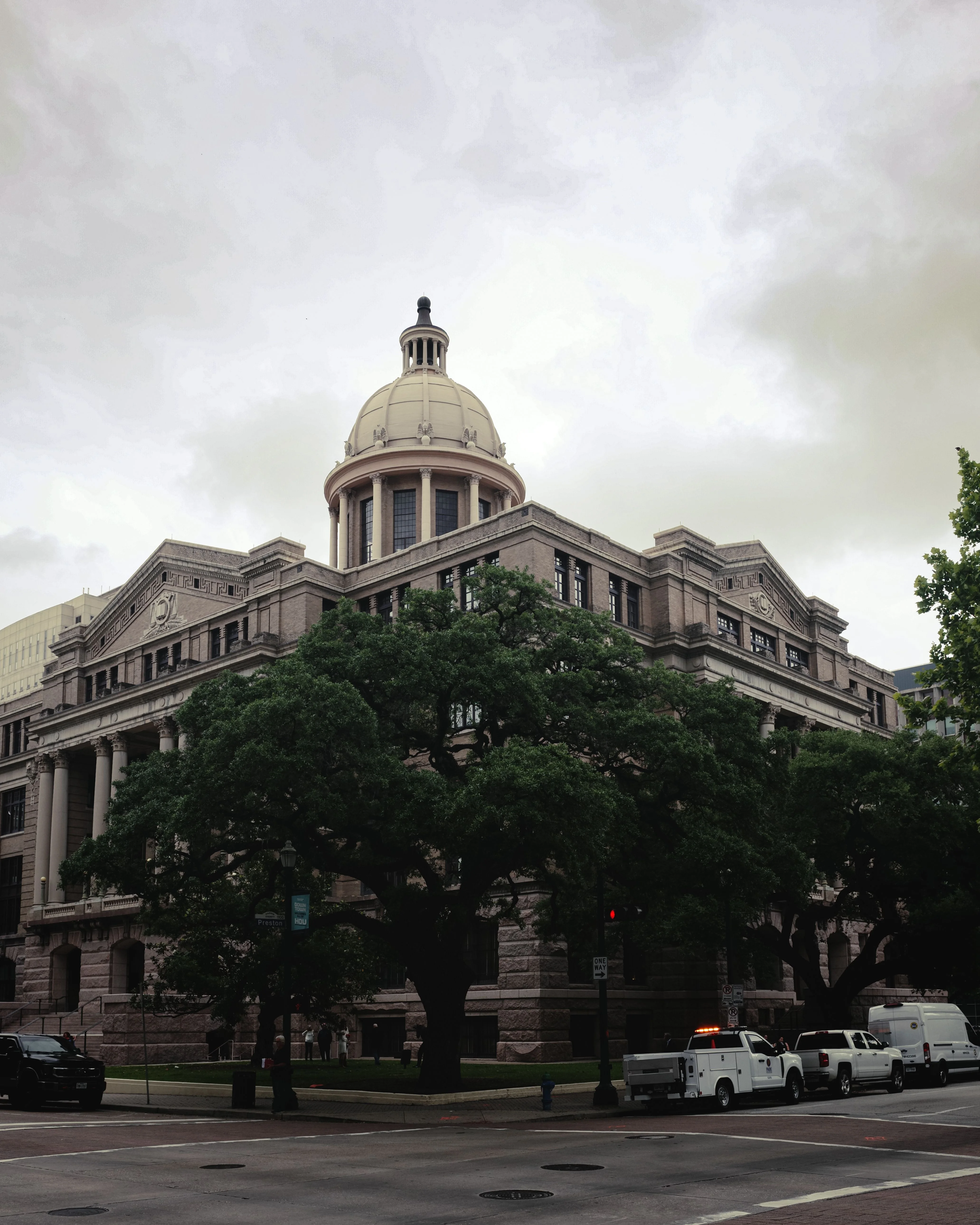 The dome and stone facade of the historic Harris County Courthouse in Houston.